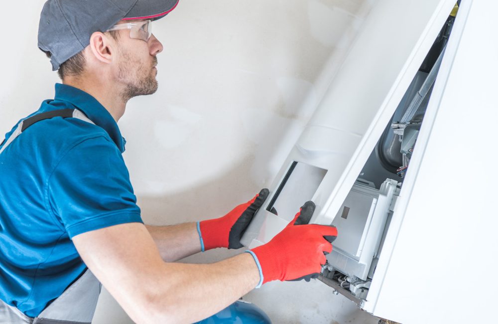 HVAC technician in Calgary performing boiler repair and maintenance – Shift Heating and Cooling Services